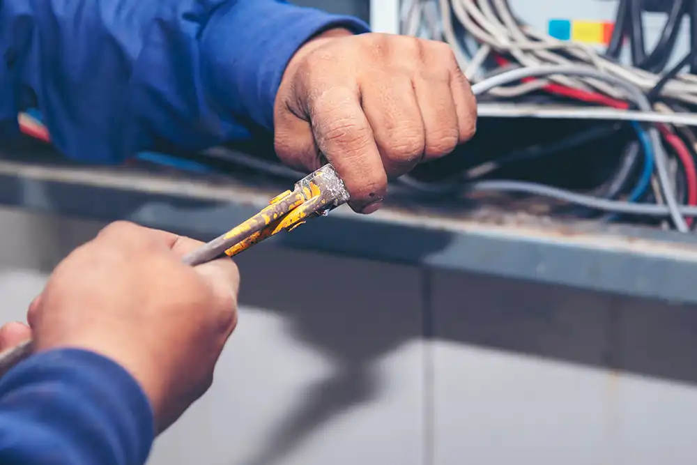 commercial electrician handling wires